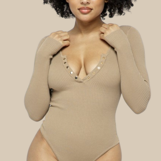 Finding the perfect bodysuit has never been so easy! This nude ribbed bodysuit is sleek & sexy for day or night!